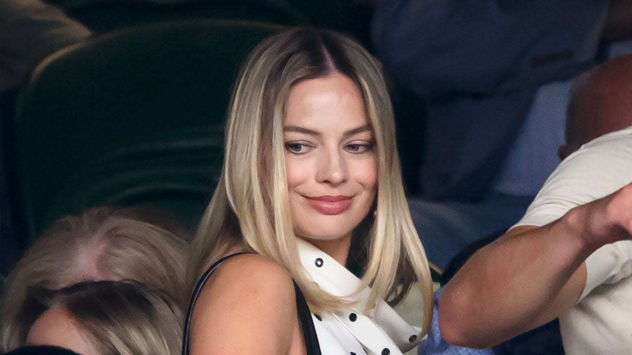 Pregnant Margot Robbie Cradles Baby Bump While at Wimbledon