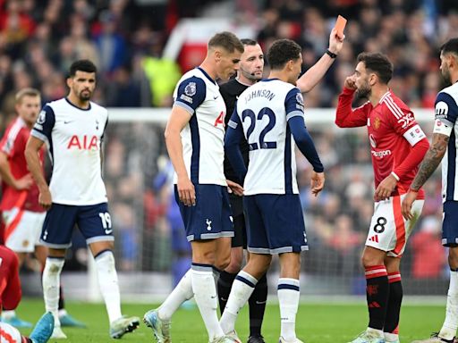 Manchester United’s Bruno Fernandes reacts after being shown a red card for his high challenge on Spurs’ James Maddison