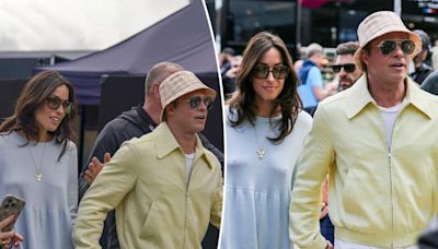 Brad Pitt and girlfriend Ines de Ramon hold hands at British Grand Prix in rare public outing