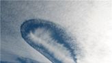 ‘Hole-punch’ in the sky: Clouds created by airplanes