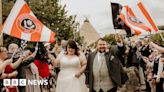 Derby County fans' wedding photobombed by rival flags