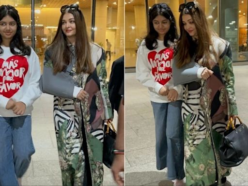 Aaradhya Bachchan refuses to leave her injured mom Aishwarya Rai's side as they return to Mumbai from Cannes. Watch