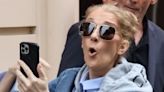 Celine Dion puts on an animated display as fans swarm her Paris hotel