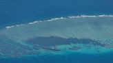 China claims Philippine warships damaged reef at atoll in South China Sea