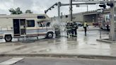 RV goes up in flames on rainy day in busy intersection