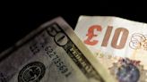 Sterling eases against dollar but heads for monthly gain