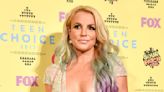 Britney Spears Cheekily Rolled Around Topless on the Beach While Teasing Dramatic New Hairdo