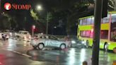 Vehicles carefully go around GetGo car left in the middle of Sembawang Road junction