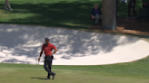 Tiger Woods shares moment with Verne Lundquist on 16 during Masters final round