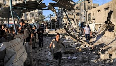 Israeli strike kills 16 at UN-run school in Gaza as ceasefire talks continue