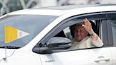 Pope Francis tours Indonesia in ordinary family car as he faces first test of health during historic Asia trip