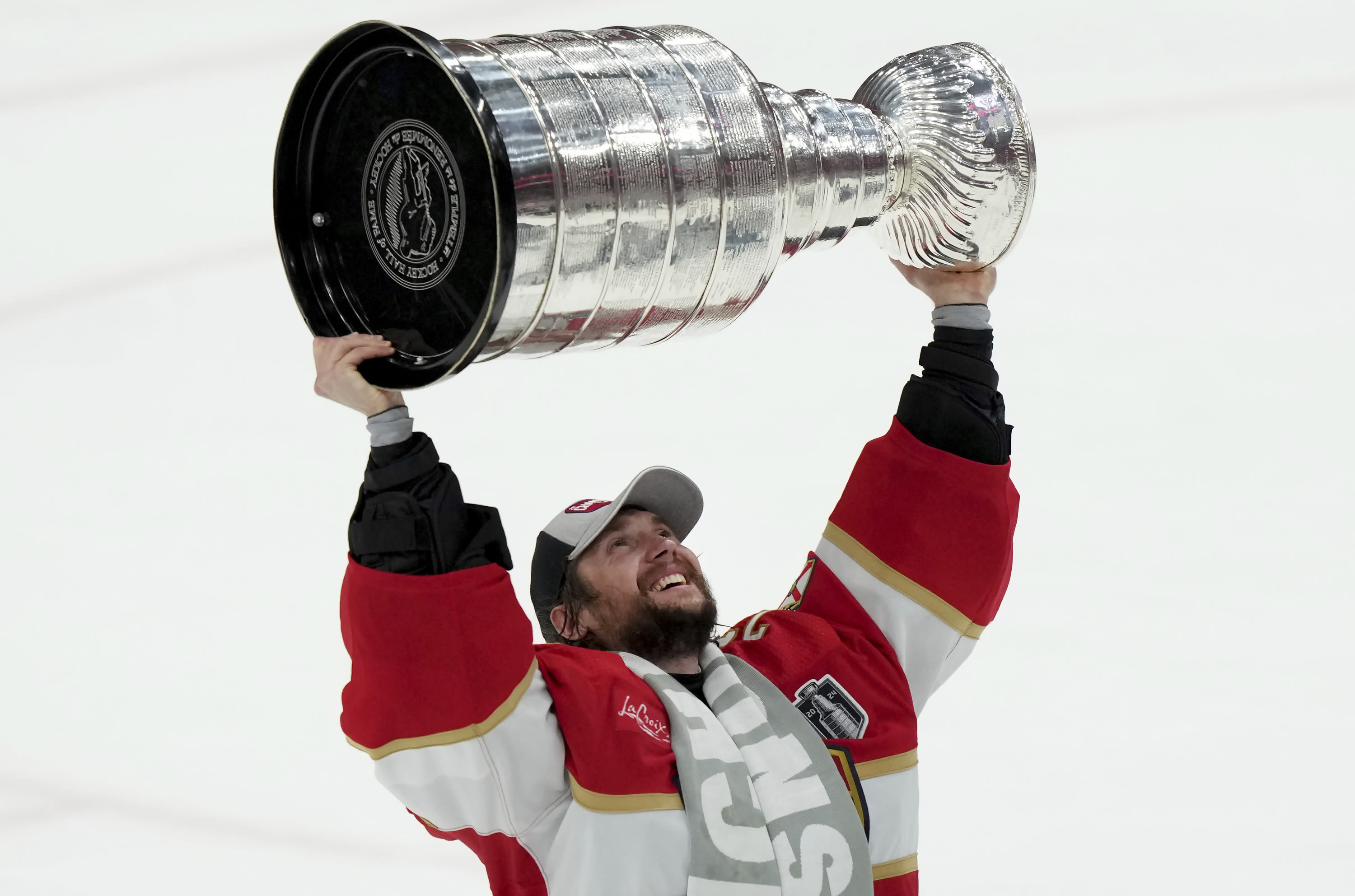 Matthew Tkachuk celebrates winning Stanley Cup with dad Keith and brother Brady