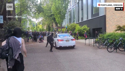 Man drives car towards crowd at Portland State University, uses pepper spray - CNN Video