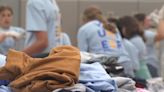 Light Orlando volunteers sort clothes for Central Floridians in need