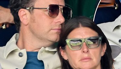 Jools Oliver looks VERY relaxed lying on husband Jamie at Wimbledon