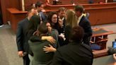 Johnny Depp’s legal team hug and celebrate after winning defamation case