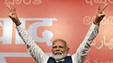 India's Modi claims victory as he heads for reduced majority