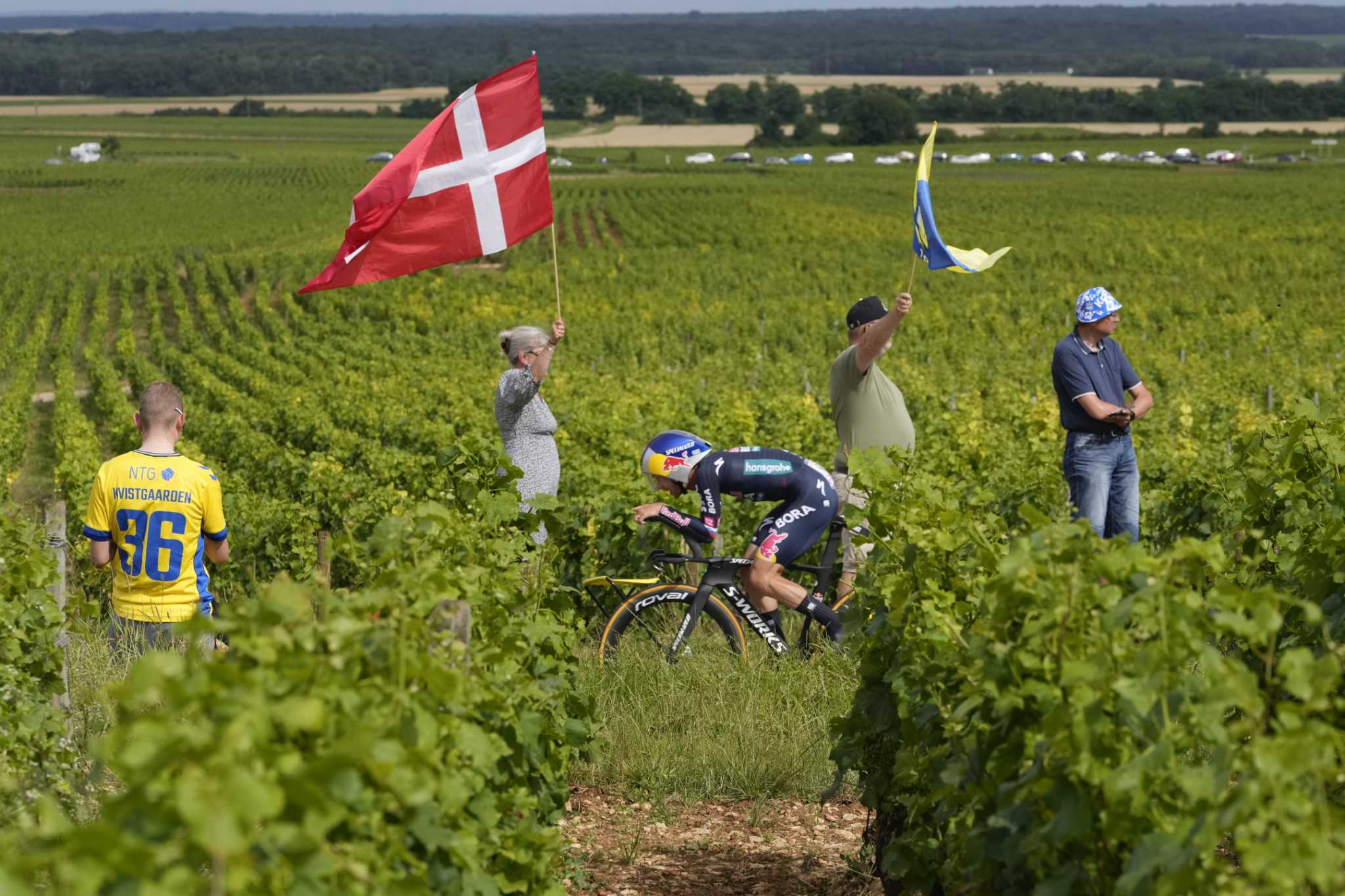 AP PHOTOS: A race to capture the Tour de France before it flies by