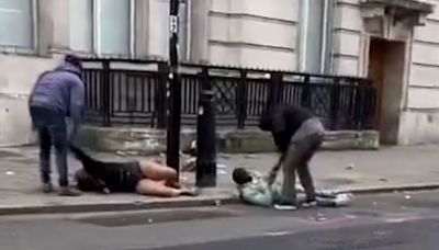 Horrific moment two people 'mugged' by thugs near London station