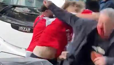 Everton fan is knocked out in clashes with Arsenal supporters