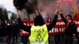 Fiery Protests Erupt Across Paris as Macron Tries to Force Pension Changes