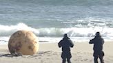 Japan is mystified by a giant metal sphere that washed up on a beach. An expert said the ball isn't a 'Godzilla egg,' but just a buoy.