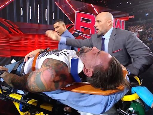 CM Punk Stretchered Out of WWE Raw After Drew McIntyre Attack