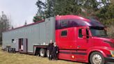 A retired couple spent 5 years and $180,000 converting a dilapidated semitrailer into a 'monster' mobile home with a library, spiral staircase, and hot tub. Take a look inside.