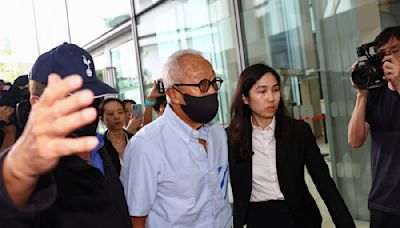 Singapore charges property billionaire linked to jailed minister's case