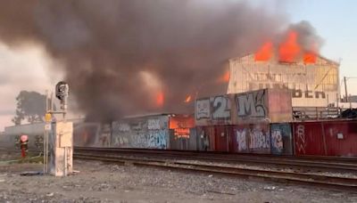Oakland firefighters battle 4-alarm fire that broke out at lumber yard