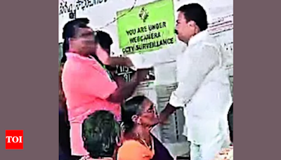 MLA tries to jump queue, slaps objector, gets slapped back | India News - Times of India
