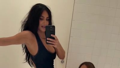 Khloé Kardashian hilariously helps Kim snap her bodysuit shut: ‘This is what sisters do’