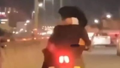 Man in Bengaluru booked for riding bike with a woman in his lap. VIDEO
