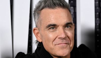 Robbie Williams 'beating himself up' after awkward 'rude' encounter with Cher