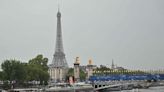 Paris Olympics: Teams sail down Seine in rain-soaked opening ceremony