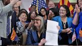 Arizona governor’s signing of abortion law repeal follows political fight by women lawmakers