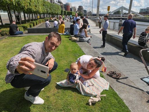 Can you spot yourself? Glaswegians pictured enjoying sunshine at Clyde side