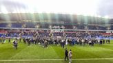 Reading vs Port Vale match abandoned after pitch invasion by fans protesting against Dai Yongge's ownership