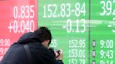 Stock market today: Asian shares are mixed, taking hot US inflation data in stride