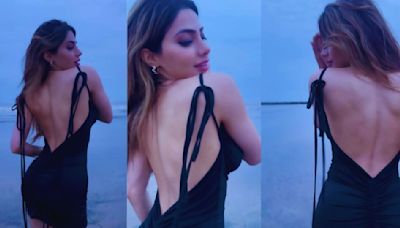 Bigg Boss 14's Nikki Tamboli flaunts her hot back on beach, fan says, 'Samundar Bhi Khud Main Tham Sa Gaya'; Watch