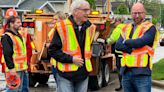 Gov. Evers grabs a shovel, fills potholes in Green Bay