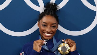 Simone Biles wins gold, pulls out GOAT necklace with 546 diamonds in it