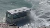 Shocking moment abandoned ice cream van is swept out to sea by powerful waves