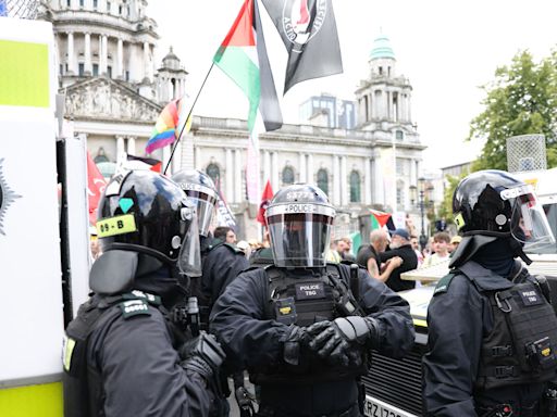 Violent clashes and businesses attacked amid anti-immigration protest in Belfast