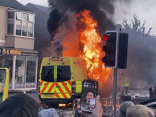 Police clash with an unruly crowd gathered near the site of UK stabbing attack that killed 3 girls