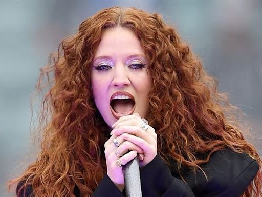 Jess Glynne showcases her figure in black crop top as she performs at The Guinness Women's Six Nations rugby tournament