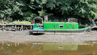 Canal boats stranded as water drains through lock