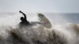 Surfers face "chaotic" waves and storm surge in hurricane season