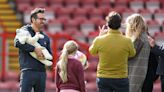 Ryan Reynolds and Blake Lively pose for photos with their newborn at Wrexham game