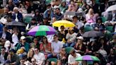 Heavy downpours suspend play on outdoor courts at Wimbledon